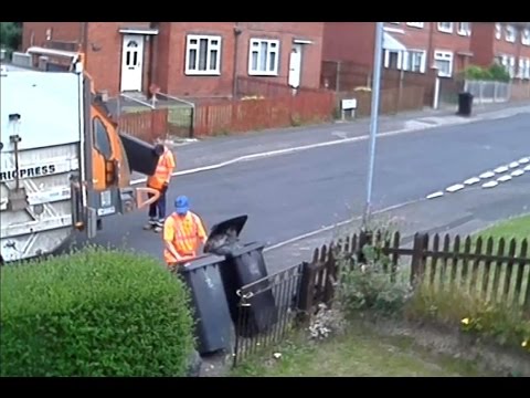 CCTV of Bin Man Taking Rubbish Out Of Bin And Dropping It Onto Street