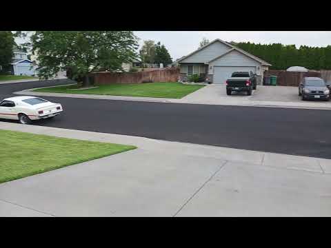 The White 69 Mach 1 Mustang and the Red 70 Mach 1