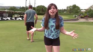 Emma plays golf