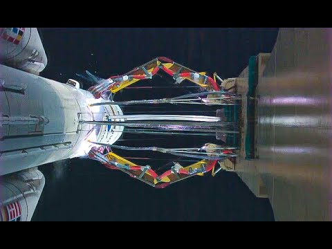 Ariane 5 ECA - liftoff launch pad close-up, slow motion and ascent to space beach view - B-Roll