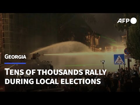 Georgian police fire tear gas as protesters try to enter presidential palace | AFP