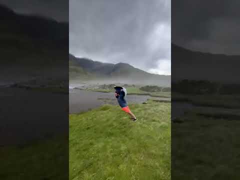 Wow! Windy weather produces gusts so strong that man can fully lean forward without falling