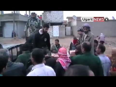 توزيع المعونات الإغاثية في مدينة رأس العين في محافظة الحسكة من قبل كتائب غرباء الشام