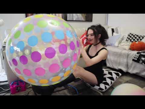 Inflating beach balls and puncturing jumbo beach ball