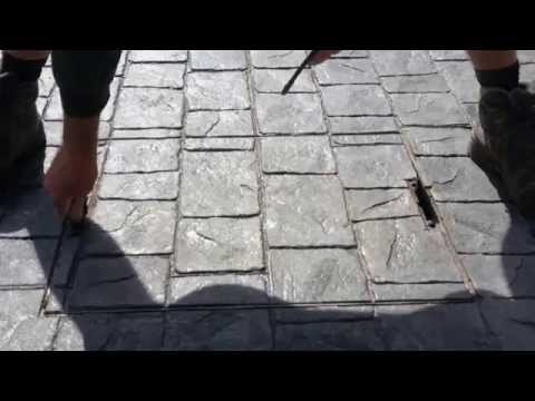 Part of a video titled How to use a recessed manhole cover with a Pattern Imprinted Concrete ...