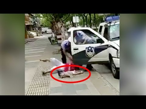 Arab Today- Policeman throws woman holding a baby