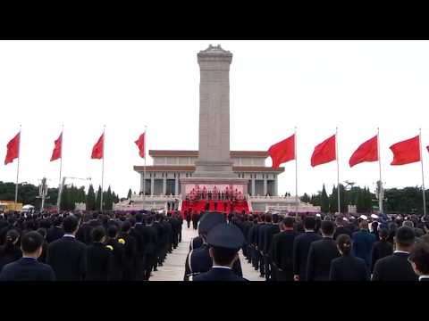 Xi Jinping presents flower baskets to fallen national heroes at Tiananmen Square