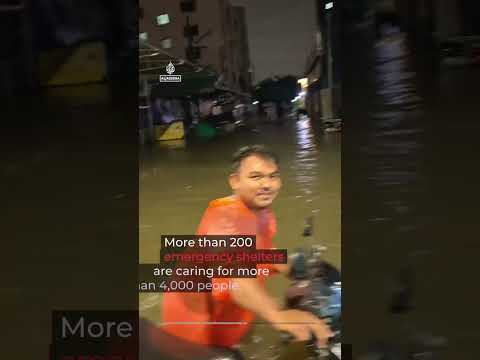 Bangkok declared disaster zone after heavy rains submerge road