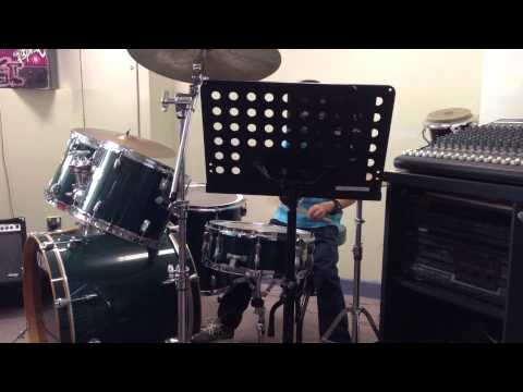 Jansen Playing Drum Set