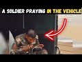 A SOLDIER PRAYING IN THE VEHICLE WHEN IT WAS TIME FOR SALAH