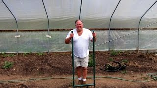 Using a Broadfork to loosen and aerate soil.