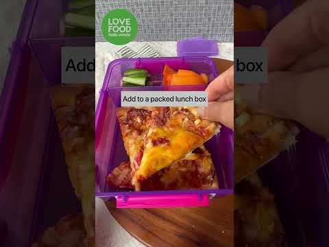 Adding pizza slices to a lunch box