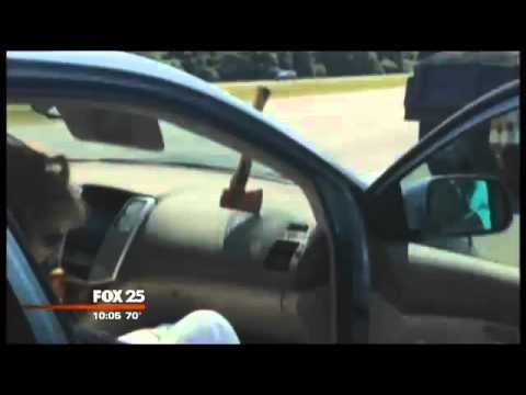 Ax flies through car window on Massachusetts highway
