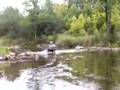 ATV Heading up the river without a paddle