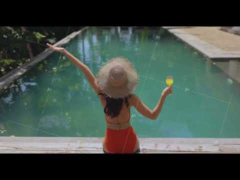 Woman in a Swimsuit and Straw Hat at the Pool During Winter Holidays
