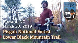 Riding down Lower Black Mountain in Pisgah National Forest on a dropbar trail bike.