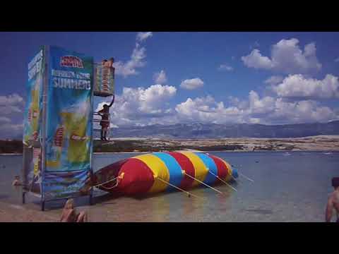 girl goes flying off the inflatable water jumping pillow | CONTENTbible