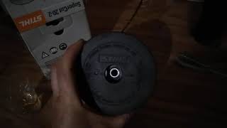 Stihl supercut 20-2 weedeater head, how it works. Demonstrated with a spoon and a 'stension handle.