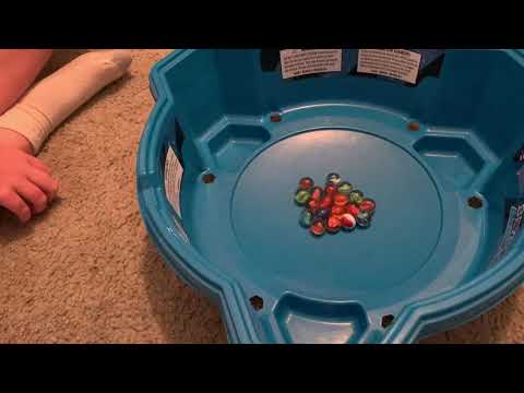 Six Beyblade’s and marbles