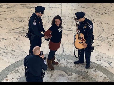 Tae Phoenix sings Brave in the Senate's Russell Rotunda during Remove Trump protests