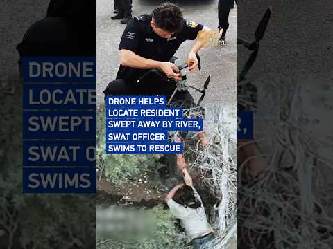 Drone helps locate resident swept away by river, SWAT officer swims to rescue#coolchina