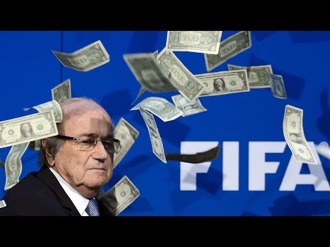 Sepp Blatter showered with fake cash at FIFA press conference