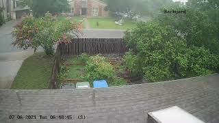 Tree falling in Backyar with rain that caused it
