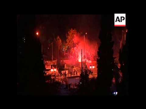 Greece fended off a bankruptcy that threatened to roil global financial markets, approving severe sp