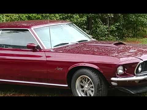 1970s maroon/burgundy mustang