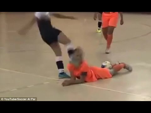 This woman football player kicking his opponent's face