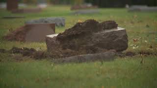Car careens through cemetery, destroying headstones