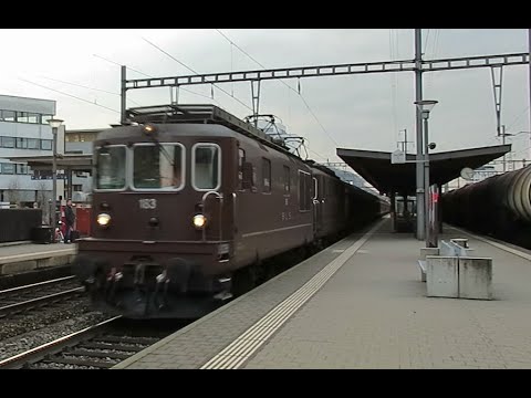Switzerland: BLS Re 4/4 (Class 425) locomotives passing Pratteln with a freight service