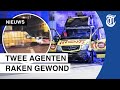 Beelden: busje rijdt in op politieauto Amsterdam