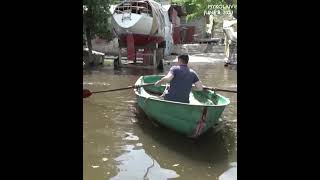 MOMENT: Man uses rowing boat on flooded streets in Mykolaiv, northeast of Kherson