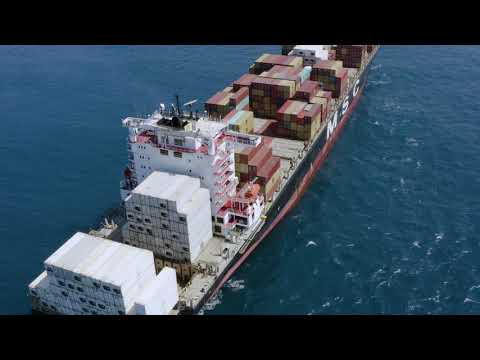Unique and Rare Short 4K Video: Cargo ship sailing, full of containers, drone view