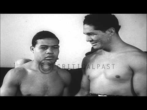 Heavyweight boxing champion Joe Louis and Chilean boxer Arturo Godoy together aft...HD Stock Footage