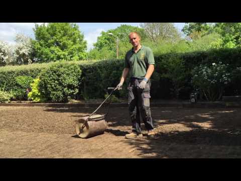 How To Strip an old mossy lawn add new topsoil then lay new turf