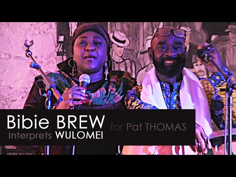Bibie BREW interprets Wulomei to Pat THOMAS