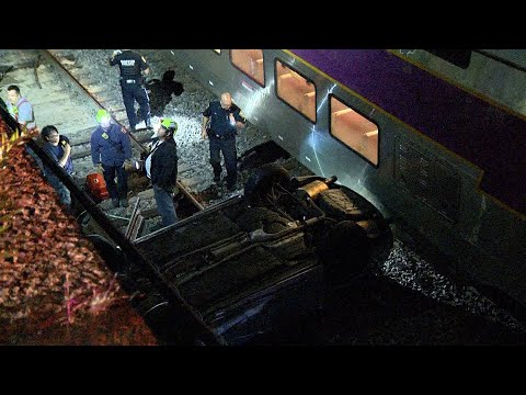 Crash sends car off 20-foot ledge, onto train tracks in Boston's South End