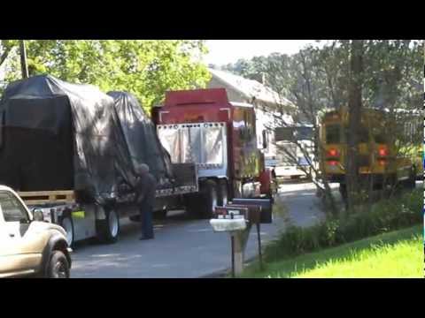 Truck obstructing a full lane of traffic in front of 1392 Darlington Road during school bus time.
