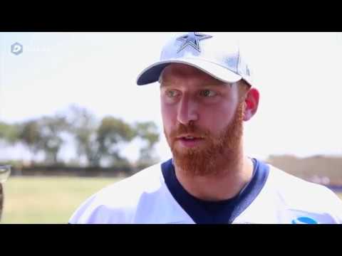 QB Cooper Rush talks with the media after practice