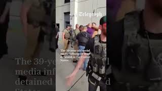 Andrew Tate gives phone away during arrest