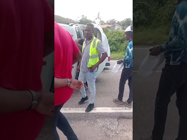 WATCH: Truck driver escapes injury after unit overturns on Spur Tree Hill