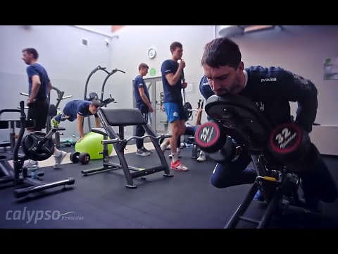 KFC Gwardia Wrocław working out at Calypso Fitness in Poland on SportsArt strength equipment.