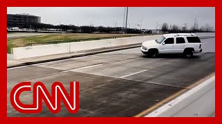 See cars slip and slide on icy bridge in Texas