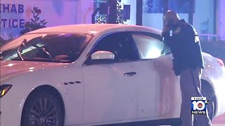 Search for shooter continues after woman shot, Maserati riddled with bullets on I-95