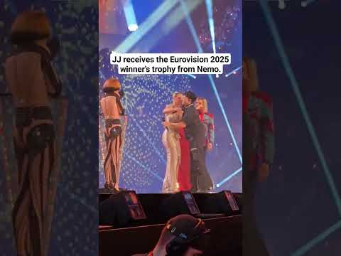 🇦🇹 JJ receives the Eurovision 2025 winner's trophy 🏆 from Nemo #Austria #JJ #WastedLove #Nemo #Basel