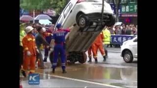 Road caves in, swallows 4 cars in China