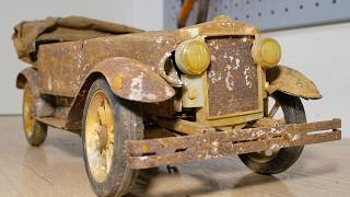 Restoration of an old toy car Phaeton