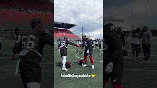 REDBLACKS rookies showing off handshakes at Mini Rookie Camp
